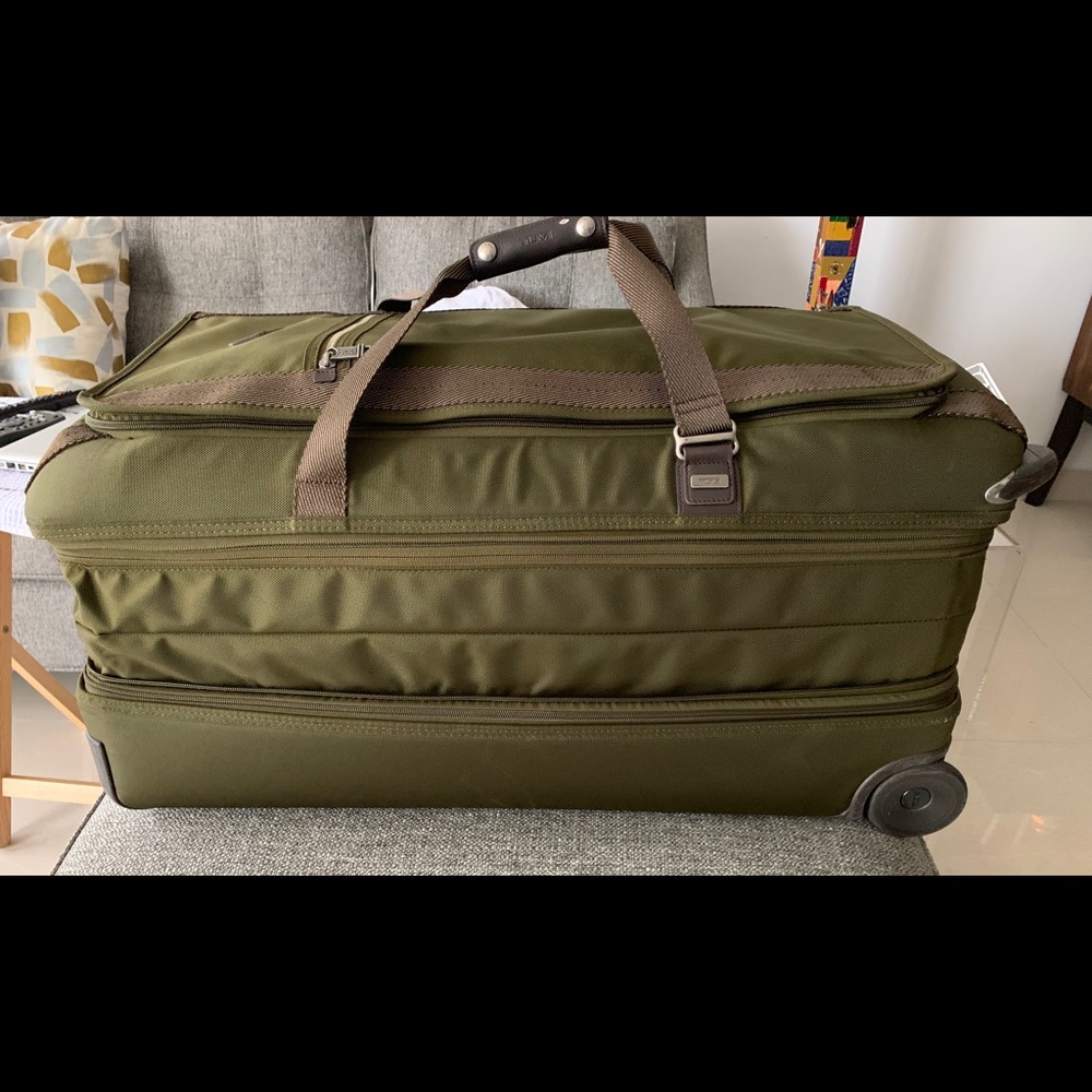 Green wheeled duffle bag.